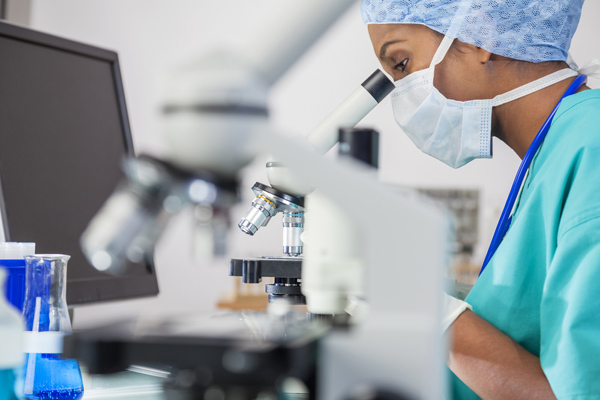 scientist with microscope